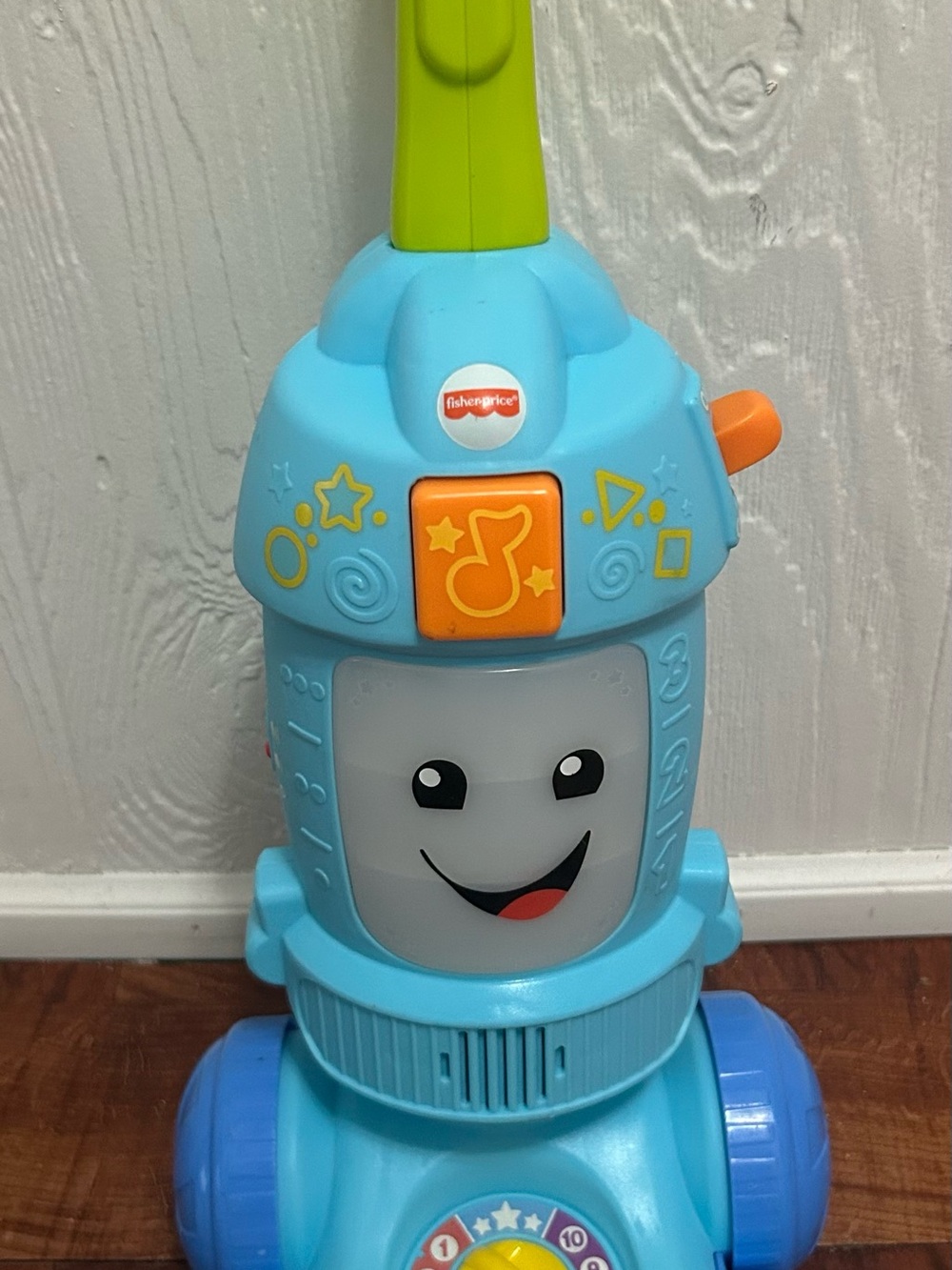 Fisher-Price Blue and Green Musical Push Vacuum Toy with Orange Buttons